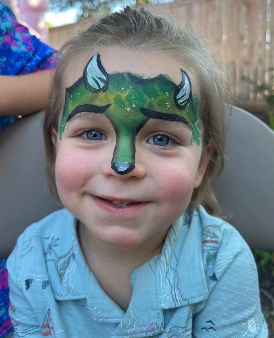 Dinosaur themed face painting at a Texas kids party