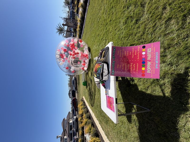 Poppin Partiez balloon twisting setup table at a DFW Texas event